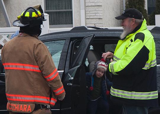 After investigating a possible gas leak, FF Cucchiara and Chief Billington assure the homeowners that their home is safe 1/28/13 Photo courtesy of RFD Firefighter Lester Millman.