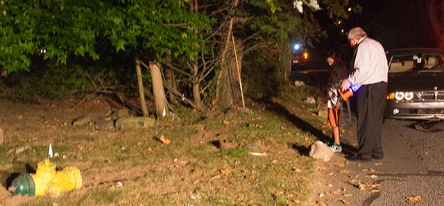 Chief Cotter and a Neighbor inspect a hydrant on Greenhaven Rd that had been knocked over by a motor vehicle 9/10/13 Photo by RFD FF Lester Millman 