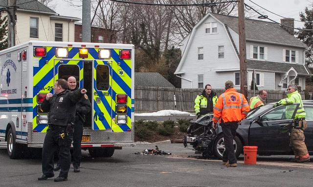 RFD Firefighters cleaning up from a MVA at the intersection of Thedore Fremd Ave and Locust Ave 2/26/13 Photo courtesy of RFD Firefighter Lester Millman