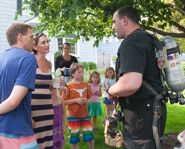 RFD Firefighter J. Loddo talks to neighbors about the dangers of Carbon Monoxide 6/29/13 Photo by RFD Firefighter Lester Millman  