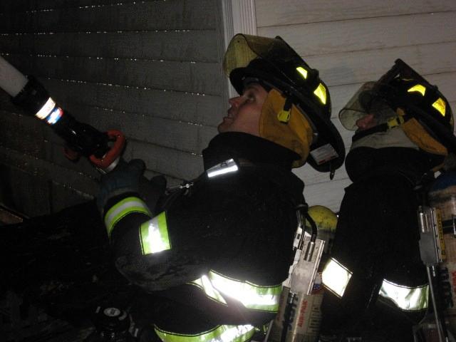 FF Barringer of MPH and FF Rossi formerly of H&L battle the flames at 27 Beck Ave 10/22/2008
