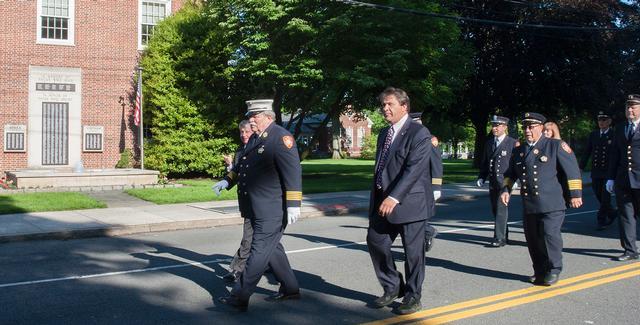 From left to right: New York State Assemblyman Steve Otis, First Assistant Chief Peter Cotter and New York State Senator George Lattimer march up Purchase St to the Firefighter Monument. Photo by RFD FF Lester Millman