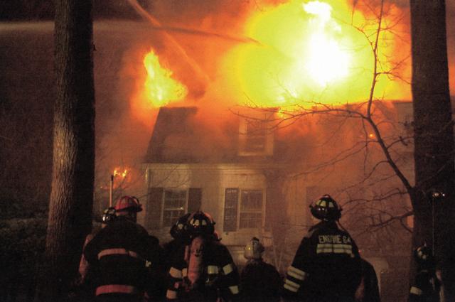 11 Thistle Lane Fire April 10, 2001.  3rd Alarm Fire with Mutual Aid from Port Chester, Harrison, Larchmont, Village of Mamaroneck.  In this picture members observe exterior operations. 