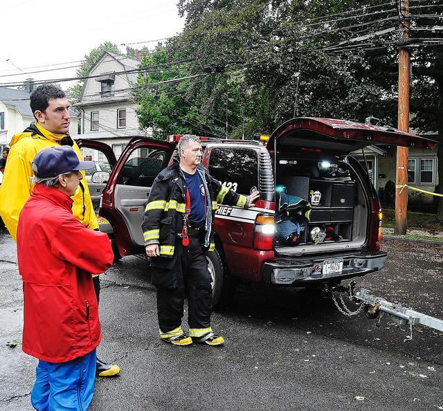 Ex-Captain Loddo (Yellow Coat) and Captain Cadigan (Right) talk to a concerned resident on Orchard Ave; Hurricane Irene 8/28/11 - Photo Courtesy of Steve Decker 