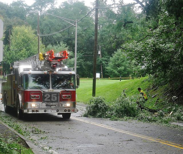Ladder 25 Crew assisting with Storm Cleanup on Playland Access Drive; Hurricane Irene 8/28/11 - Photo Courtesy of Steve Decker 