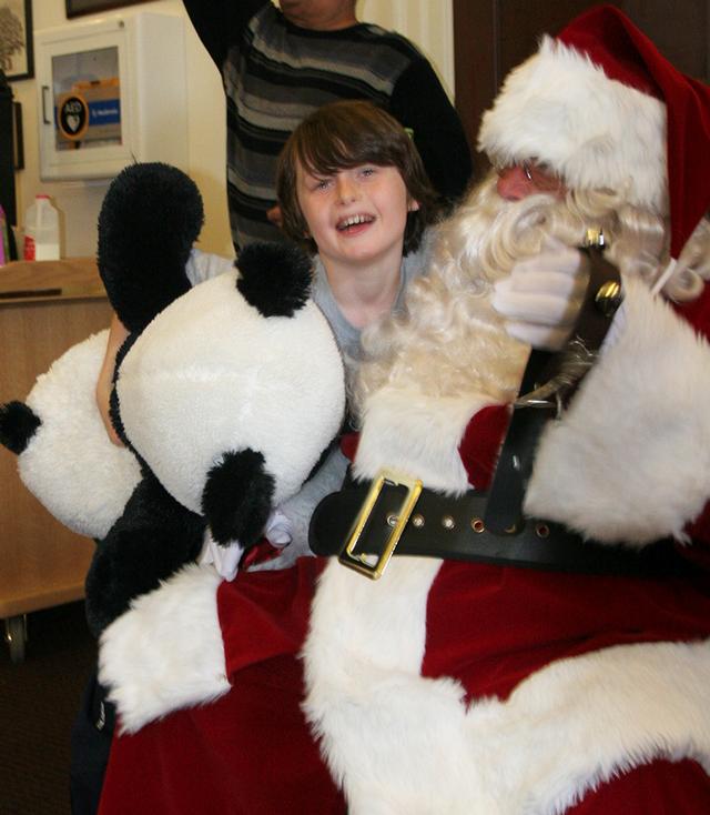 Santa stopped by RFD HQ to the delight of many kids at RFD's Children's Christmas Party 12/15/13 Photo by RFD FF Lester Millman 