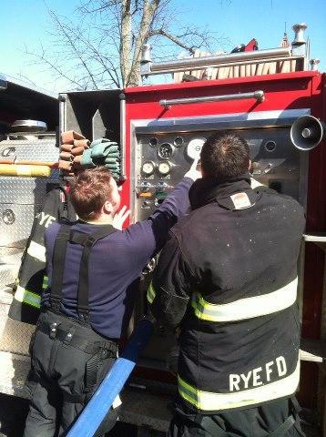 Lt. Billington and Lt. Acevedo review pump operations on Engine 193. RFD Firefighers took advantage of the warm March weather to get some training in 3/10/13
